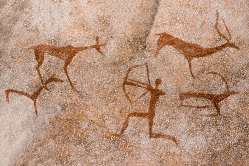 image of the ancient hunt on the wall of the cave ocher. histori